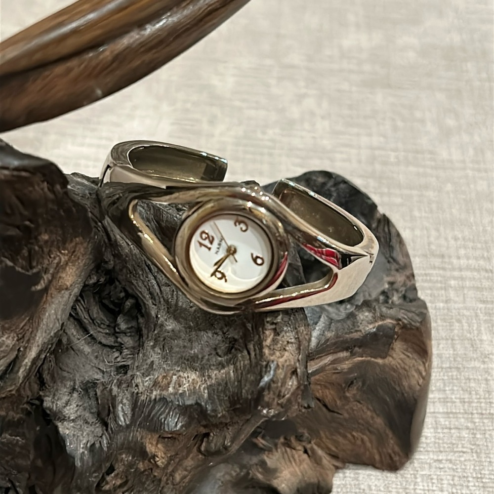 Narmi silver, and gold tone bracelet watch. Batteries needed.
